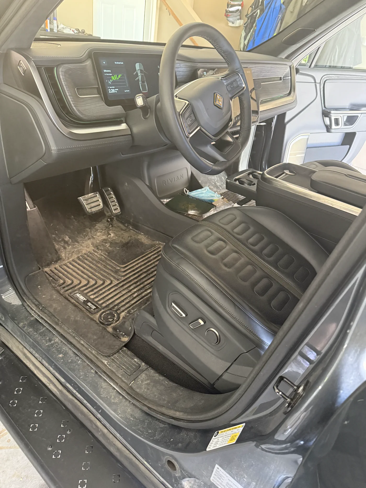 Before: Rivian R1S interior — pre-detail.